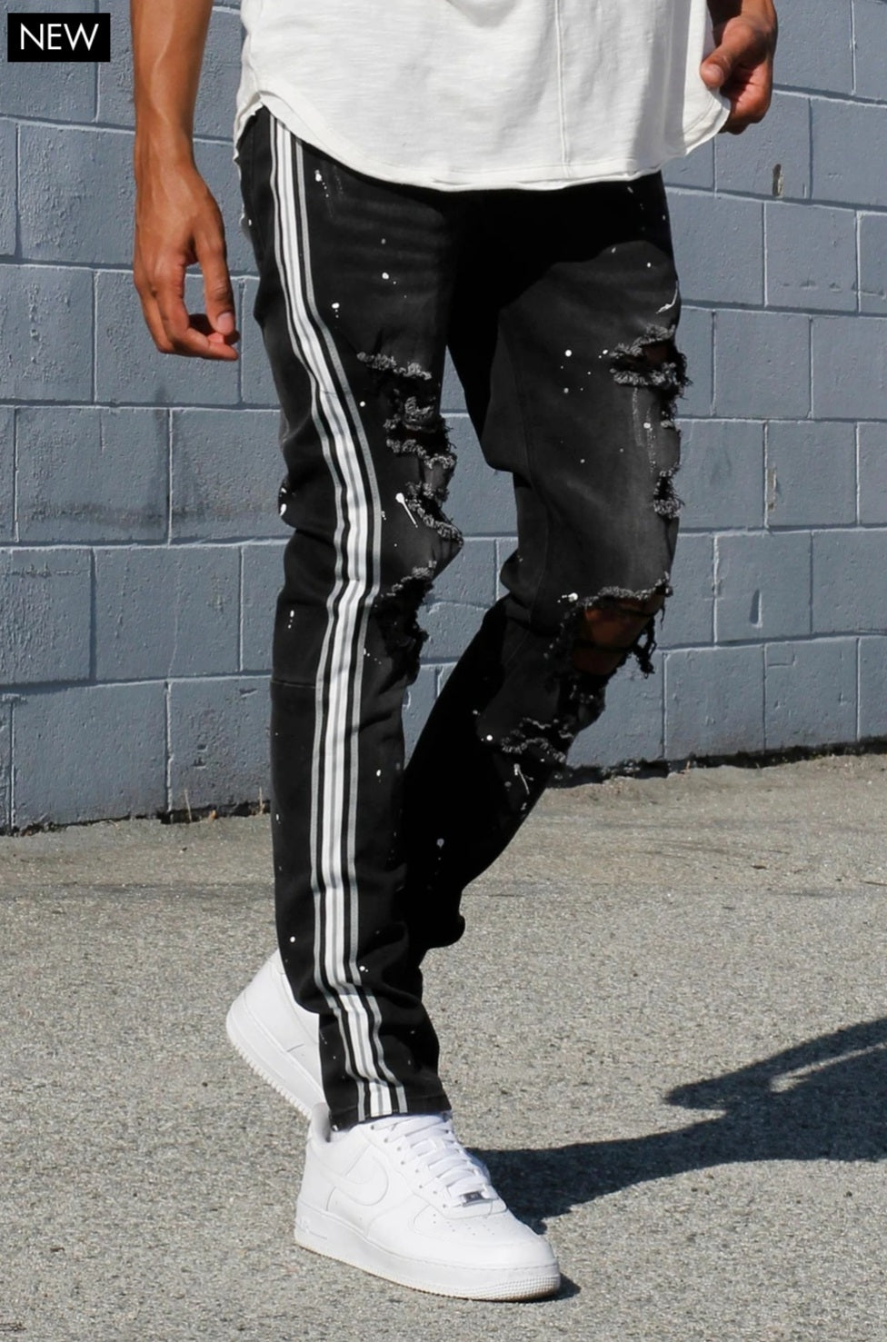 MULTI STRIPED PAINT SPLATTERED JEANS